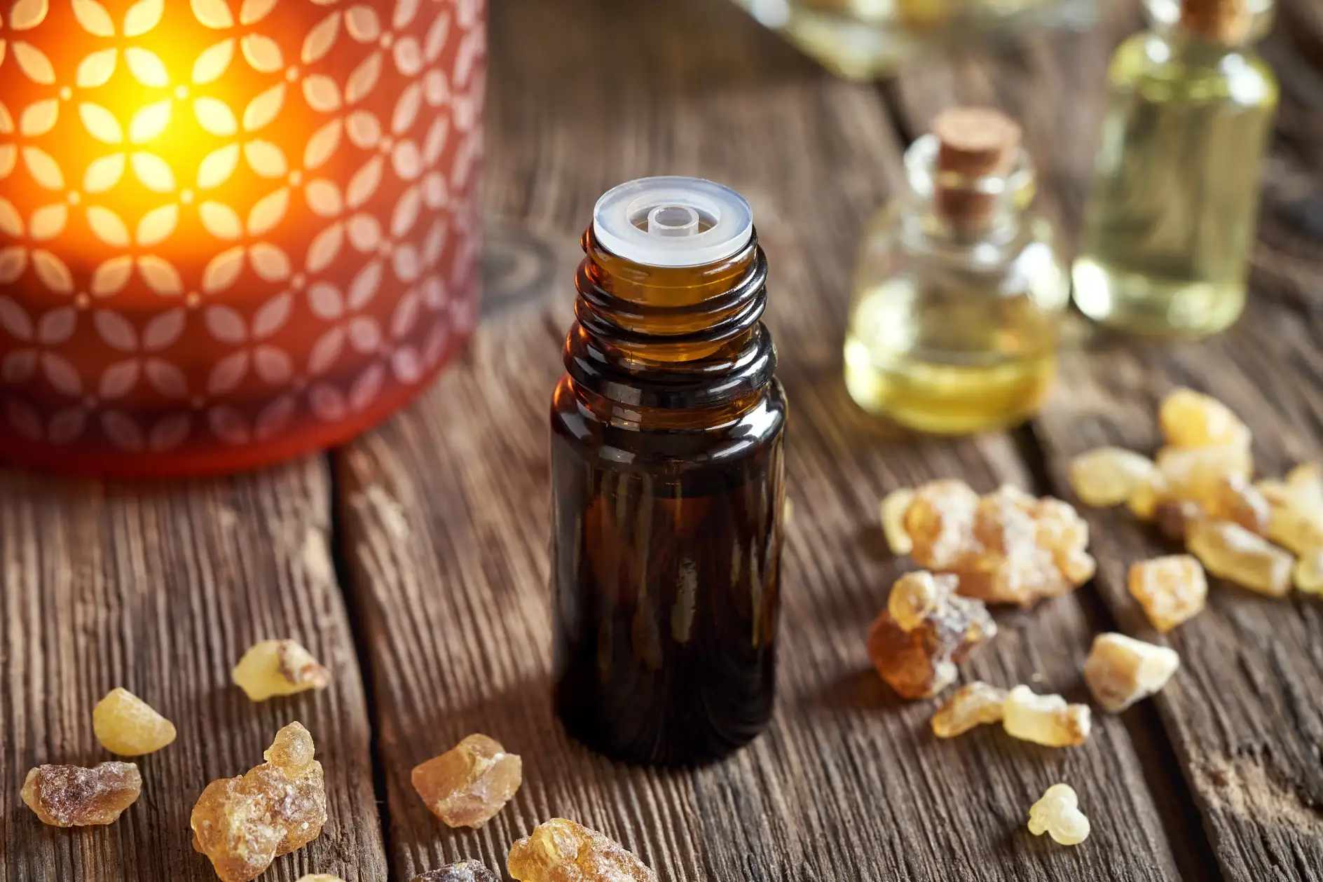 A dark bottle of frankincense essential oil with boswellia resin