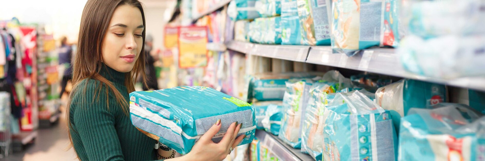 Mum buying diaper in a supermarket