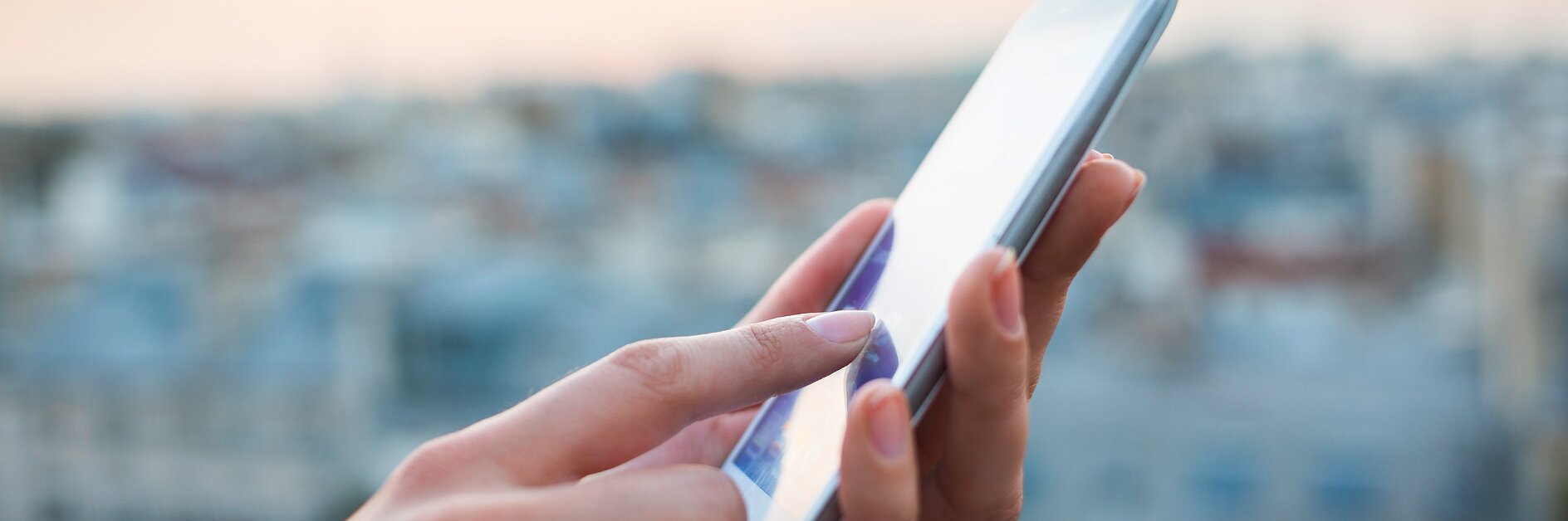 tesa woman using smartphone with city background