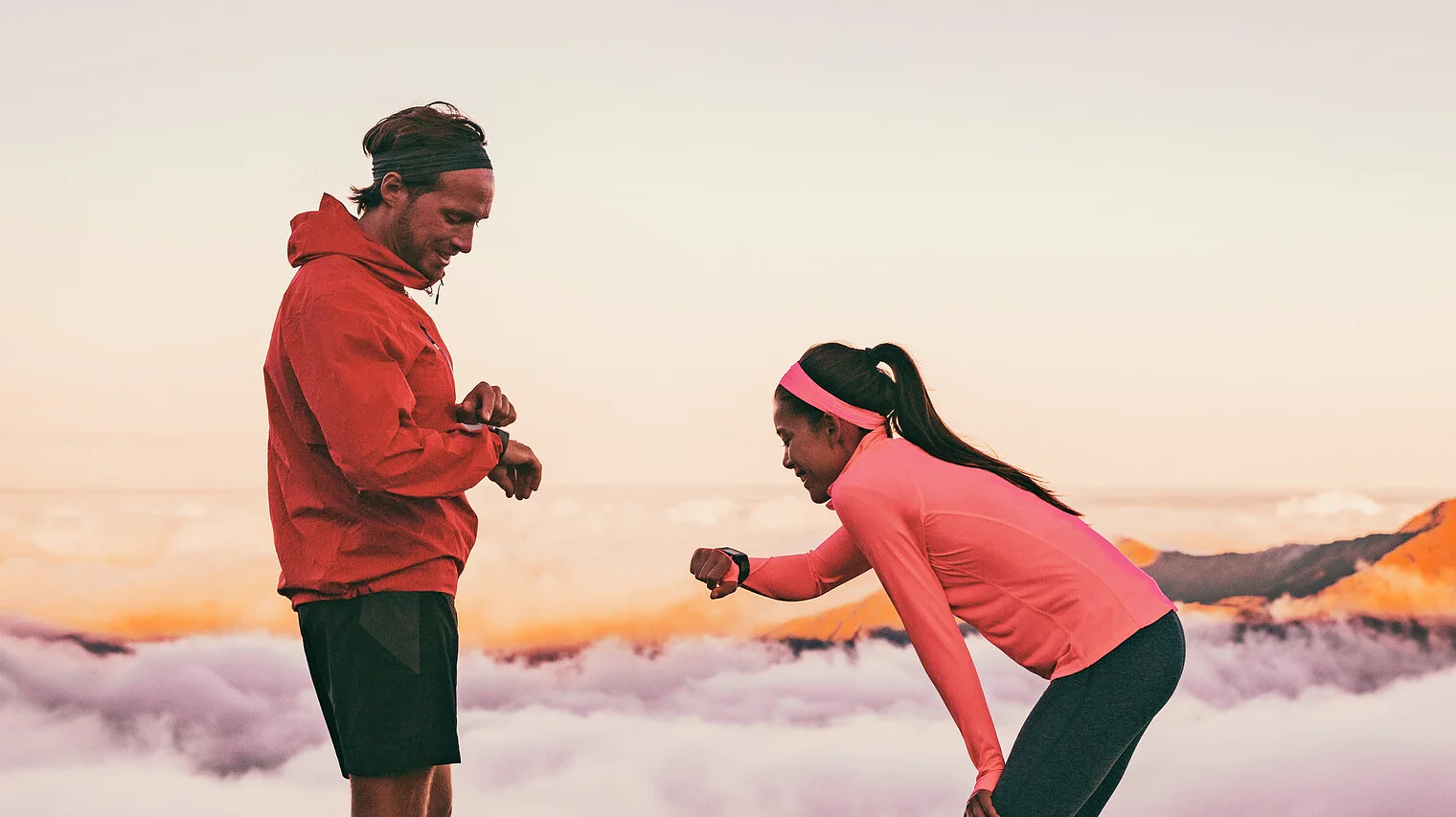 tesa runners looking at smartwatch checking health data